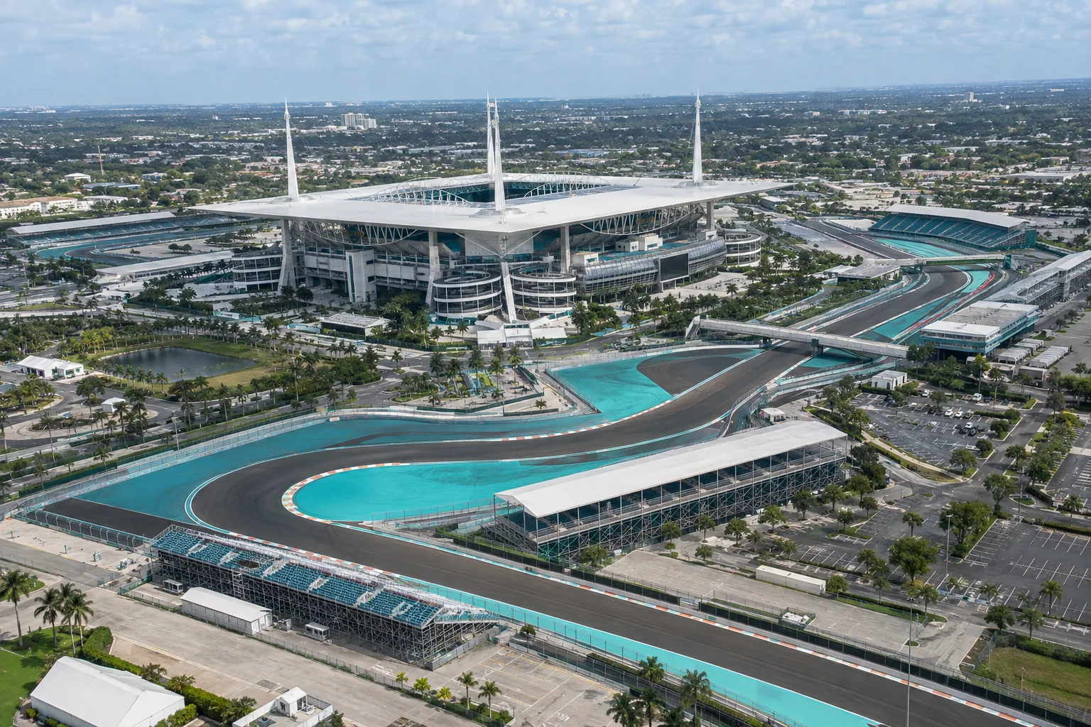 A motor racing circuit around a stadium, seen from above