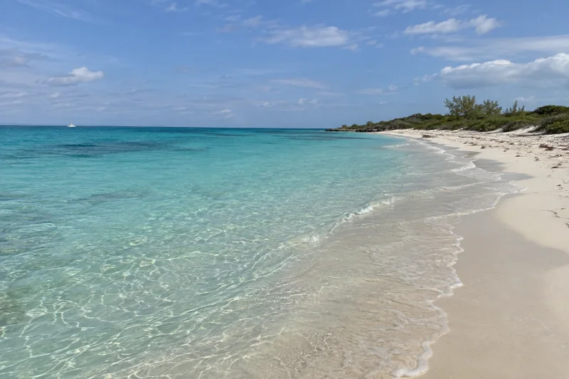 Turquoise shallows along a white sand beach in the Bahamas
