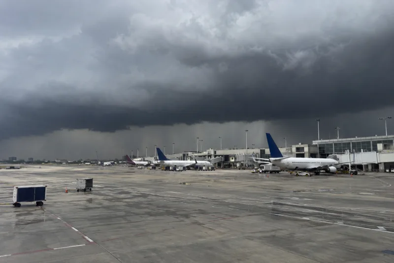 Dark storm clouds over parked aircraft