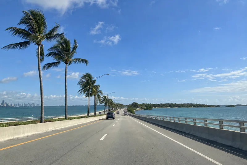 The palm-lined Rickenbacker Causeway with downtown Miami across the bay