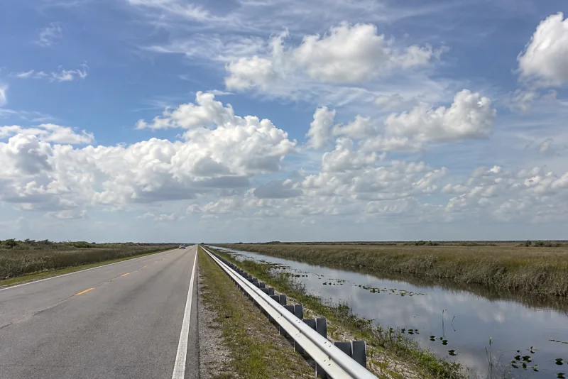 The Tamiami Trail beside its canal through the Everglades sawgrass