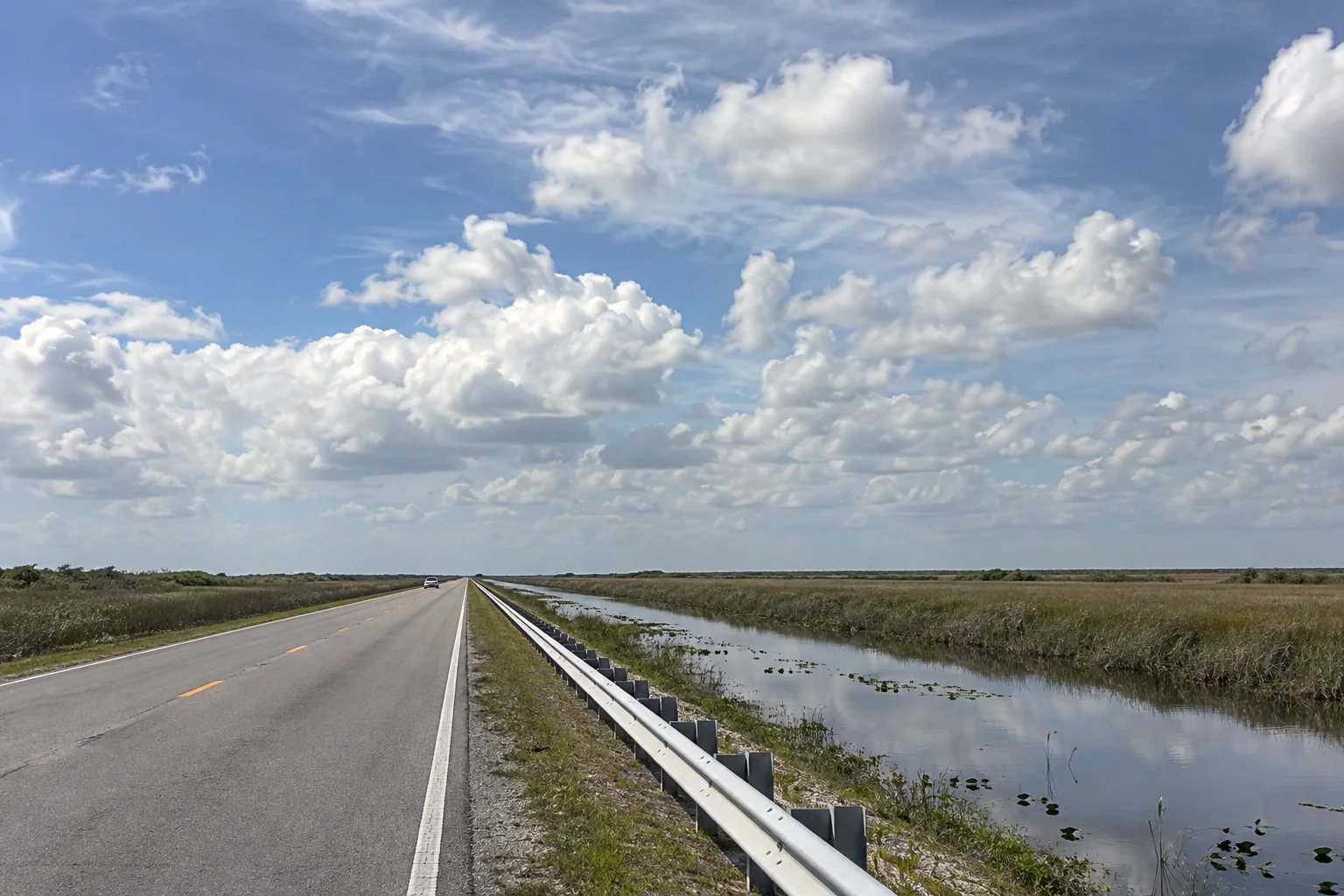 The Tamiami Trail beside its canal through the Everglades sawgrass