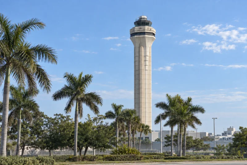 The MIA control tower behind palms